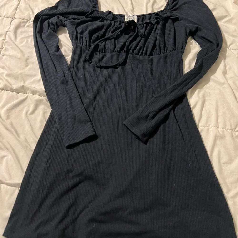 Black dress with ruffled details from Francesca’s brand blue raine.